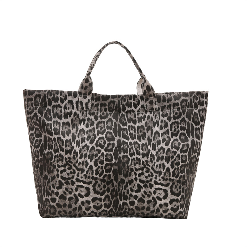 Europa y los Estados Unidos retro leopardo de gran capacidad 2025 nueva bolsa de mano de viento perezoso simple de moda de viaje elegante bolsa de mano
