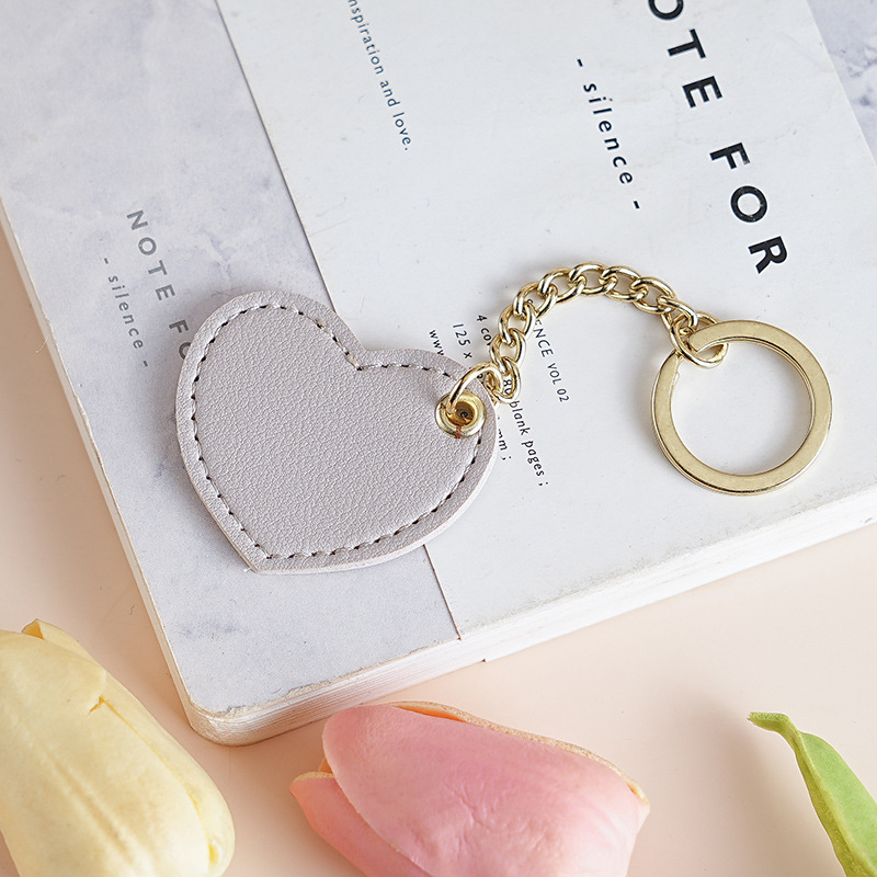 Colgante en forma de corazón gris