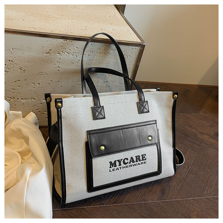 Bolso de lona de gran capacidad para mujeres 2024 nueva moda color contrastante empalme mochila de hombro simple bolsa de mano casual