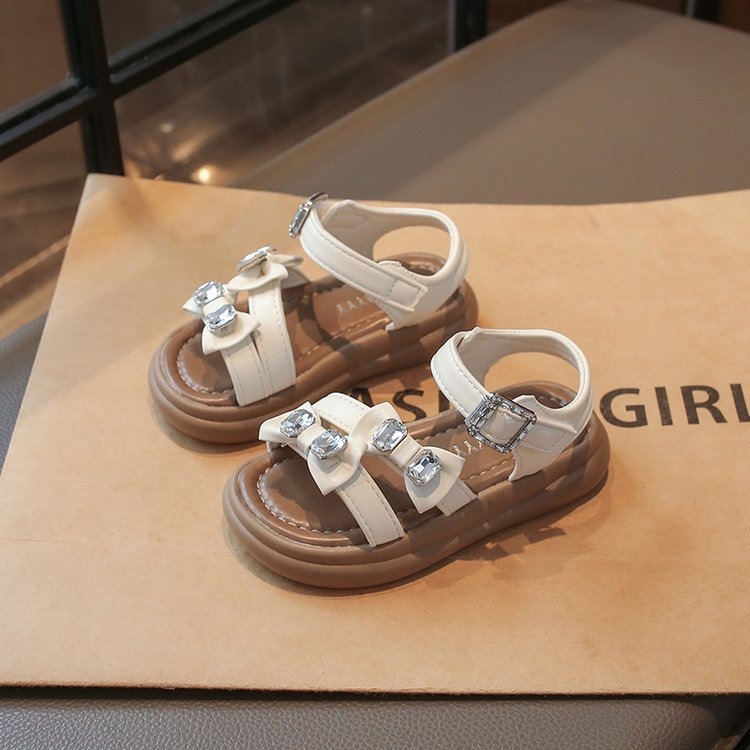 Zapatos de princesa para niñas 2025 verano nuevo estilo romano para niños con suela suave sandalias de moda de diamante
