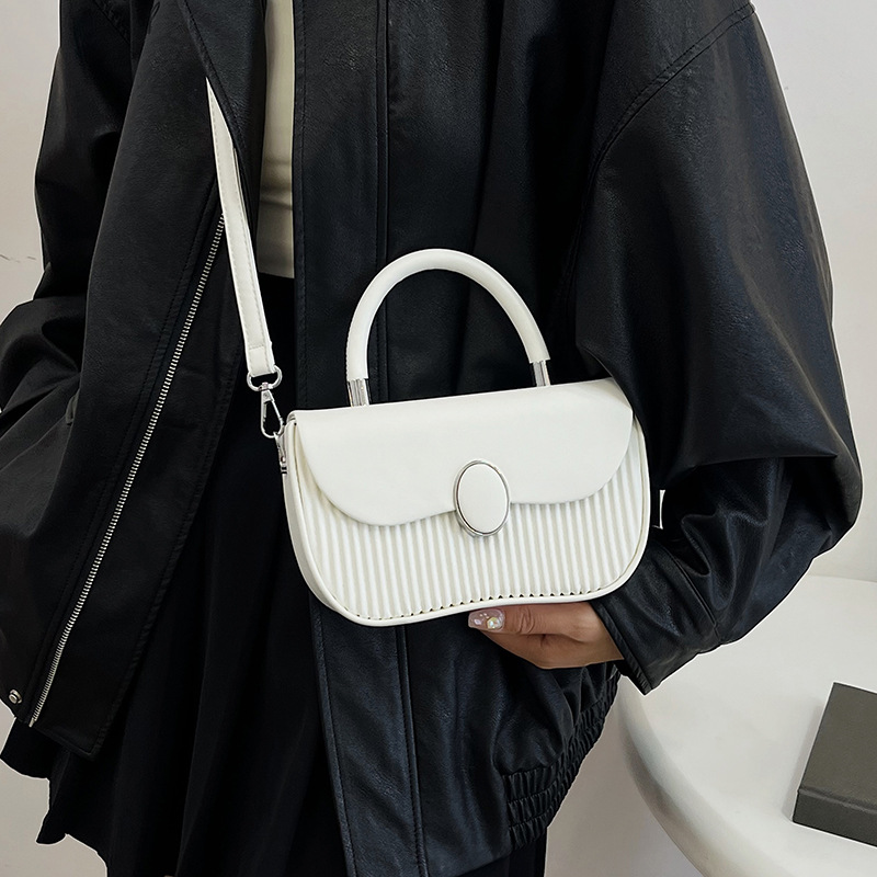 Versión coreana del bolso de nicho 2025 verano nuevo bolso femenino de alta calidad textura bolso de hombro moda bolso de mensajero a rayas marea