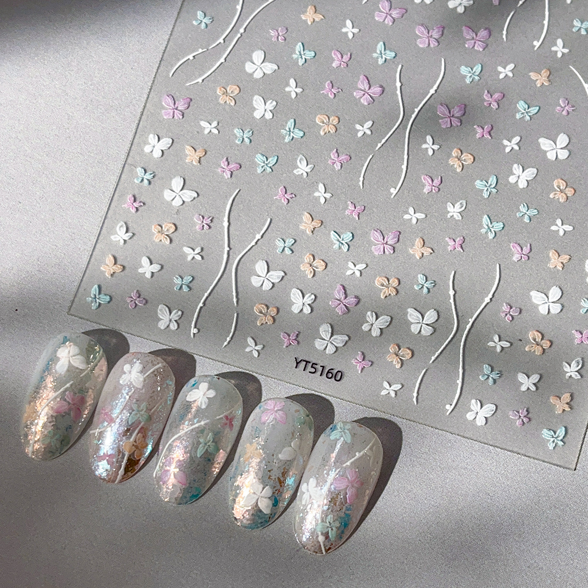 Pegatinas de mariposa de uñas nuevo estilo tridimensional pintado a mano arco de color en relieve exquisito pegamento para uñas decoraciones al por mayor