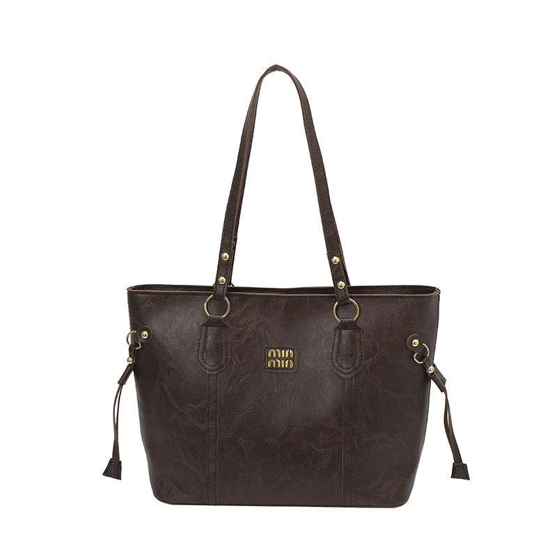 Texturas extranjeras bolsas de gran capacidad para mujeres otoño y invierno 2025, nuevas bolsas de hombro de moda, nicho, bolsas de viaje retro