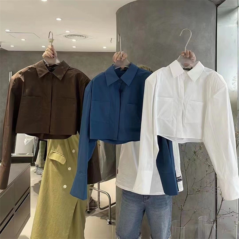 Nueva camisa de manga larga corta de color sólido de estilo coreano para niñas 2023 camisa suelta de bolsillo de solapa para niños medianos y grandes