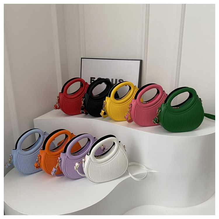 Fresco dulce dopamina color sólido rayas bolso de las mujeres este año popular pu estilo occidental bolso de hombro redondo