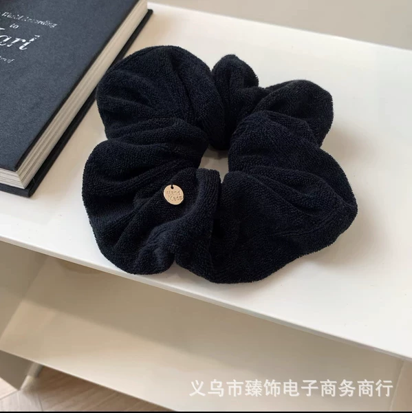 Black plush copper label