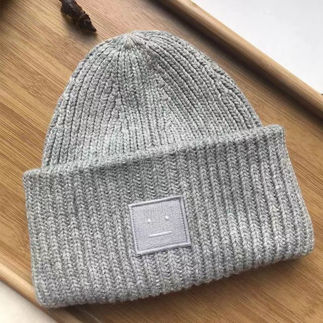 AC笑顔の帽子の四角のラベルを貼って、ウールの北欧風の冷たい帽子の韓国版のカップルの毛糸の帽子の高品質の冷たい帽子を巻きます。