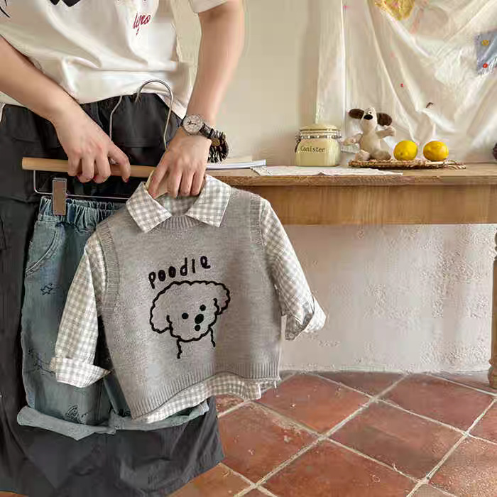 Chaleco infantil 2025 primavera y otoño nuevo niño sin mangas camiseta de punto de perro con suéter de bebé hombro de la mujer
