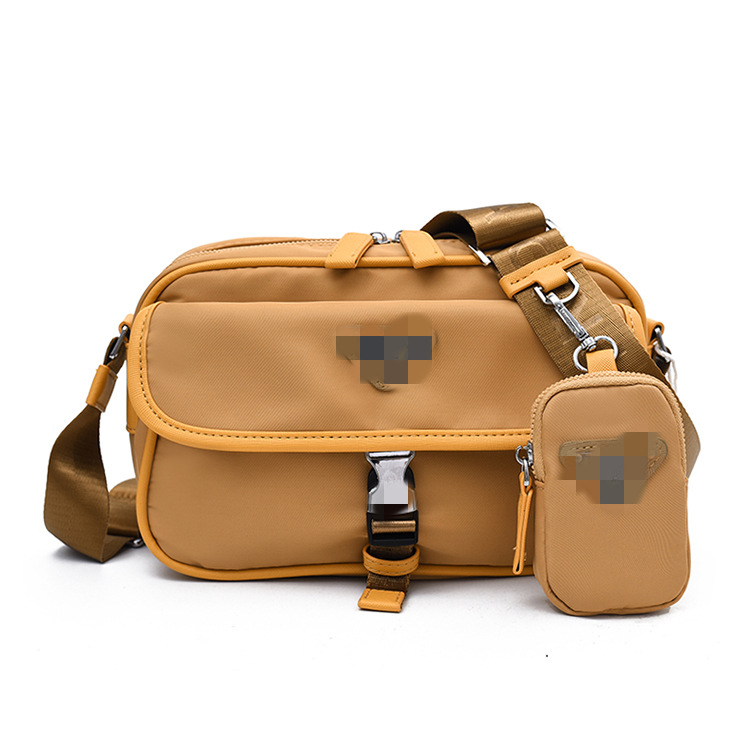 Bolso de mensajero del mismo estilo para hombres y mujeres de renombre Bolso de cámara de nylon de la casa P mediano Bolso de mensajero de un solo hombro tres en uno sentido avanzado