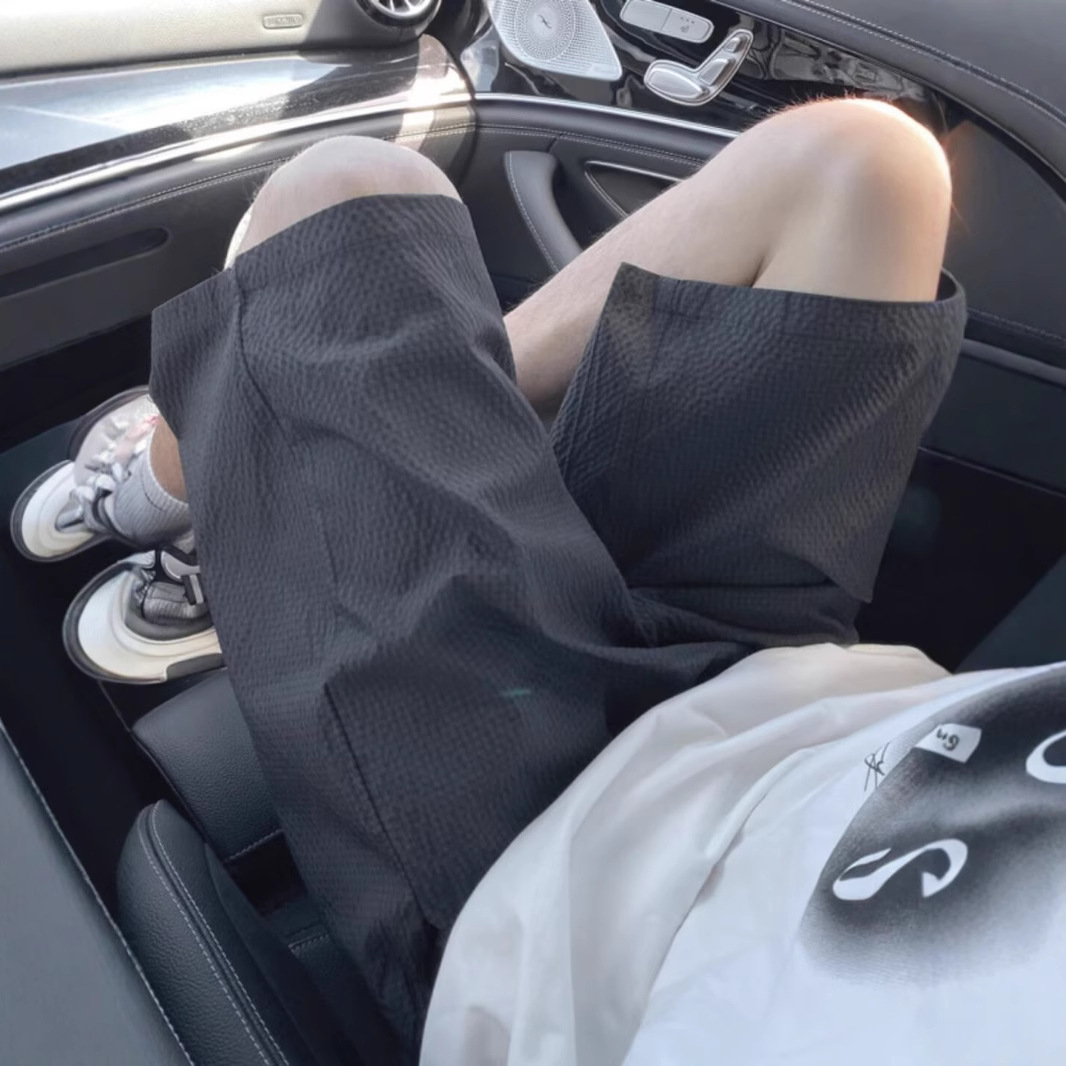 Pantalones cortos de secado rápido a cuadros de burbujas para hombres verano nuevo estilo pantalones de playa de color sólido tendencia americana pantalones delgados de cinco puntos