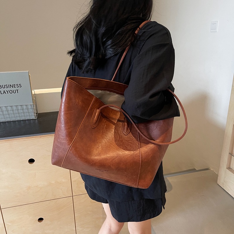 Bolsa de mano transfronteriza de gran capacidad para mujeres 2025 nueva bolsa de brazo portátil de viaje de alta calidad bolso de hombro casual