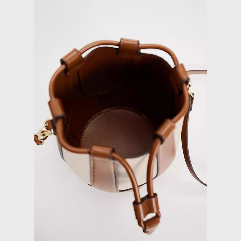 Ny eksklusiv skuldertaske i lærred med patchwork og kvindeligt nichedesign, afslappet bucket-taske til pendling_voghion.com