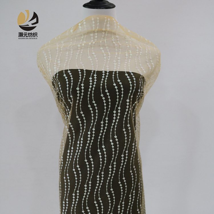 Fabricantes de venta de bajo precio ondulado fantasía polvo brillante tela de malla vestido de noche tela de boda