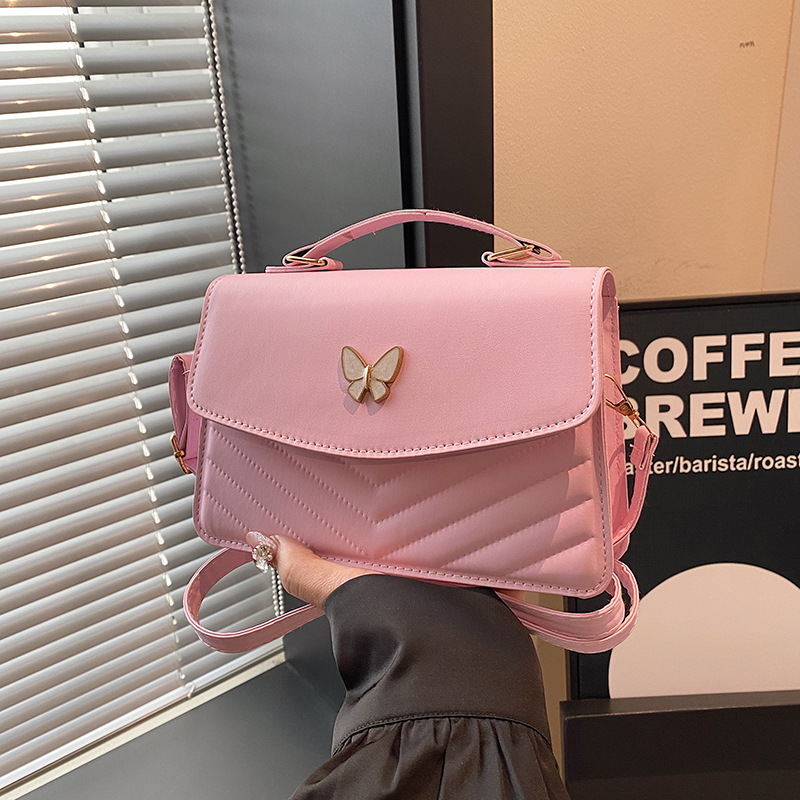 Bolso bordado de color sólido otoño y invierno 2024 nuevo estilo retro bolso de moda simple bolso de mariposa de moda