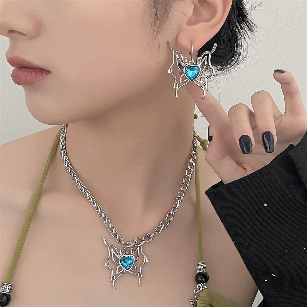 Juego de collar y pendientes mariposa con cristal corazón azul_voghion.com