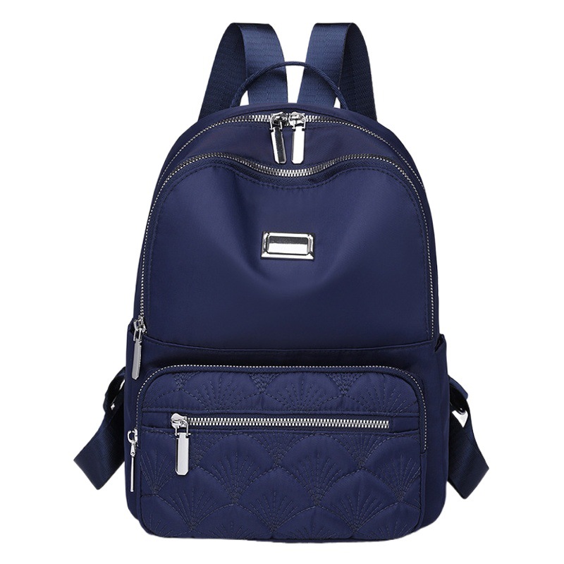 2024 nueva mochila de nailon casual para mujer simple y versátil mochila de viaje ligera al aire libre mochila escolar al por mayor