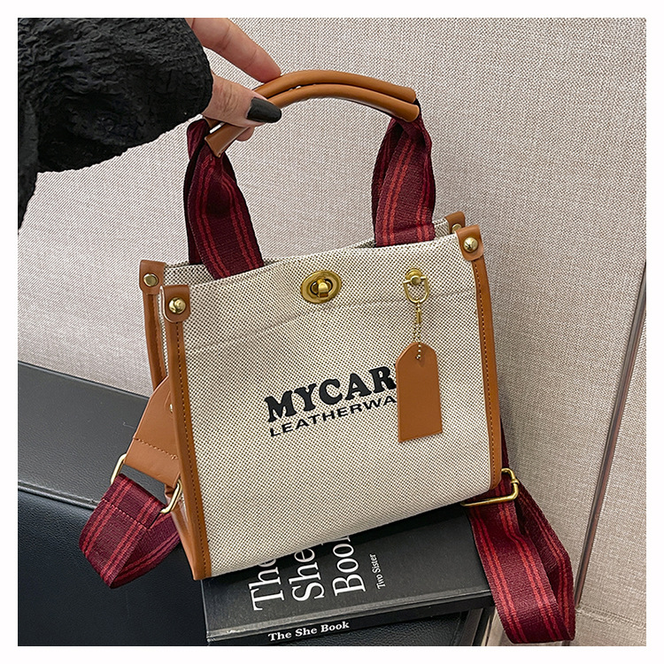 Bolsa de mano de lona de gran capacidad para mujeres 2024 nueva moda impresa letras mochilas bolsa de viaje casual