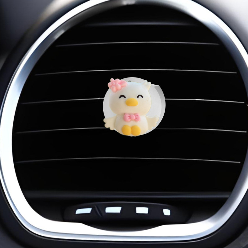Clip de salida de aire de coche pequeño pato amarillo resina aromaterapia de coche perfume de coche adornos de dibujos animados accesorios de decoración suministros de coche