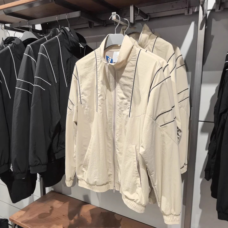 The Same Style as the Original Classic Retro Three-Stripe Casual Sports Jacket for Both Men and Women from Brand a The Same Style as the Original Classic Retro Three-Stripe Casual Sports Jacket for Both Men and Women from Brand a