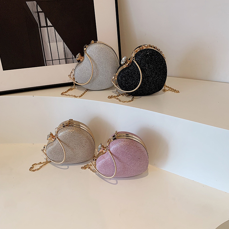 Lindo bolso de embrague en forma de corazón bolso de cena 2024 nuevo bolso de hadas de cadena de moda y dulce bolso de mensajero de un solo hombro de estilo occidental