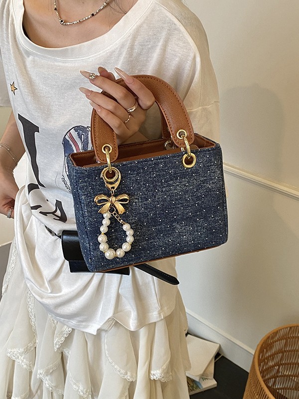 Diseño de nicho color en contraste bolso cuadrado pequeño portátil femenino 2025 nuevo bolso diagonal de diamantes retro de alta gama de moda