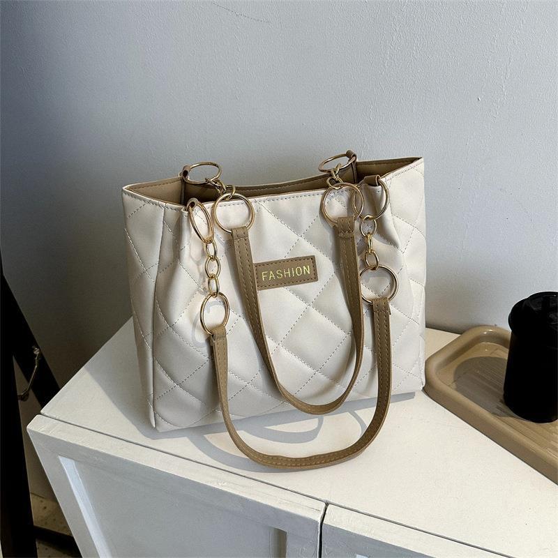 Bolso de gran capacidad de ocio para mujeres 2023 primavera nueva simple estilo extranjero de transporte de mochila de moda textura tote