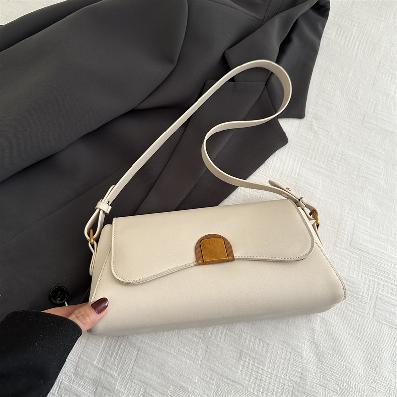 Bolso de brazo retro de palo para mujeres 2025 nuevo nicho de moda de alta sensación bolso de hombro universal bolso de mochila