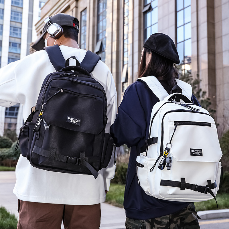 La nueva mochila de la marca de moda para hombres y mujeres de gran capacidad mochila de viaje ligera al aire libre para estudiantes de secundaria y secundaria.