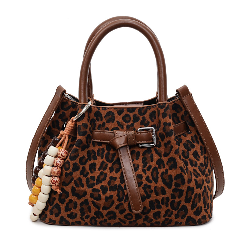 Otoño y invierno retro leopardo bolso de cubo 2025 sensación de alta calidad de mujer de cuero de seda de viaje multicasable bolso de mano casual