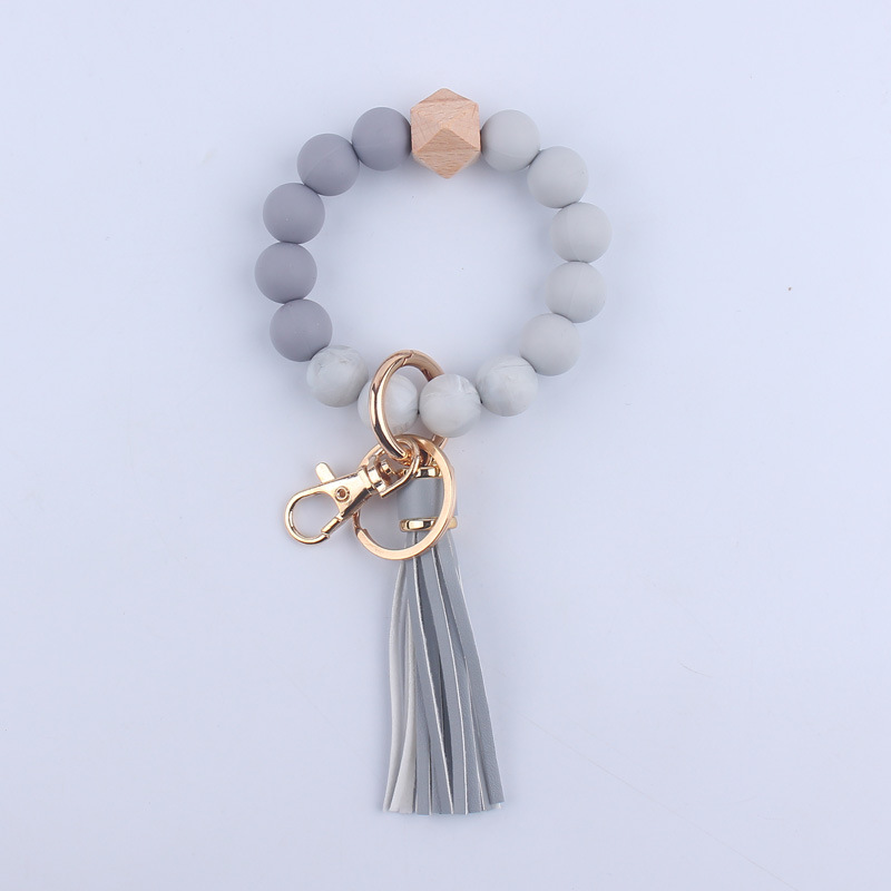 Nuevo cuero de LA PU corto Borla Llavero DIY de silicona de impresión de leopardo de color sólido con cuentas muñeca llavero colgante