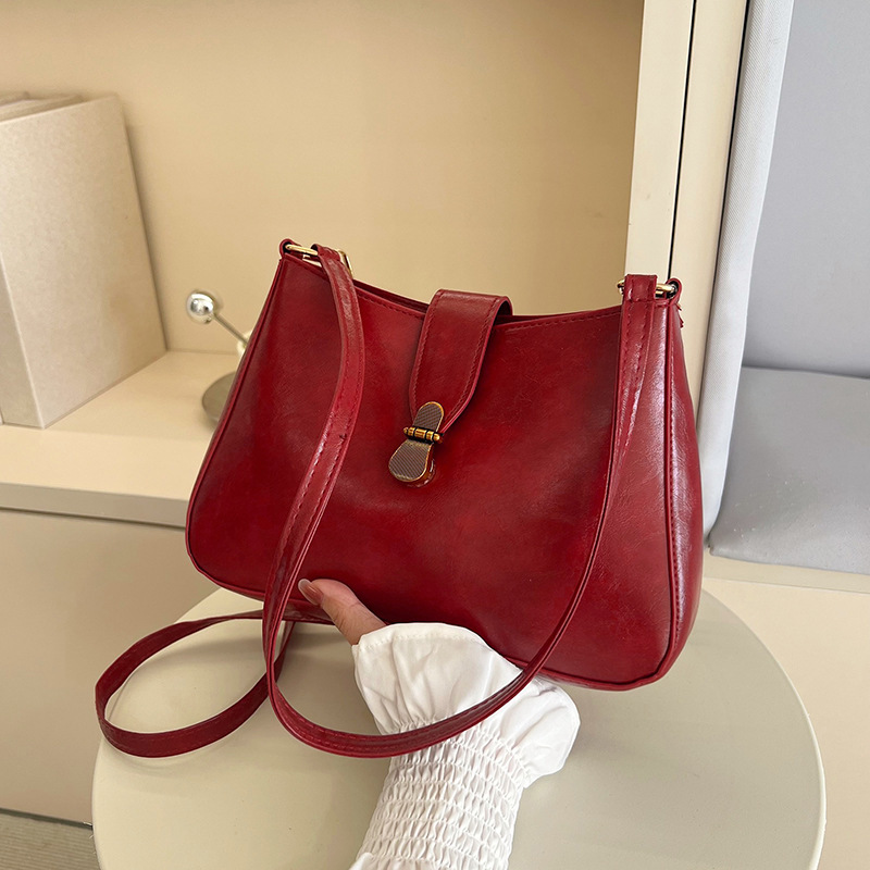Nichezhong retro simple bolso de brazo bolso de mujer 2025 primavera nueva moda bolso pequeño de viaje de moda mochila de hombro