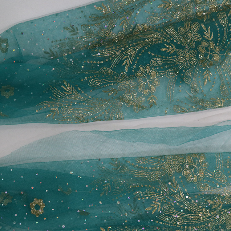 Nuevo posicionamiento flor doble polvo láser sequinilla pulverizado oro malla tela de rendimiento de ropa infantil estilo chino tela de ropa