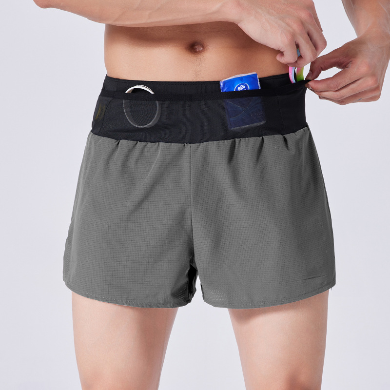 Nuevo verano falso de dos piezas corriendo pantalones cortos deportivos de secado rápido Baloncesto de los hombres maratón de fitness entrenamiento todoterreno pantalones de tres puntos
