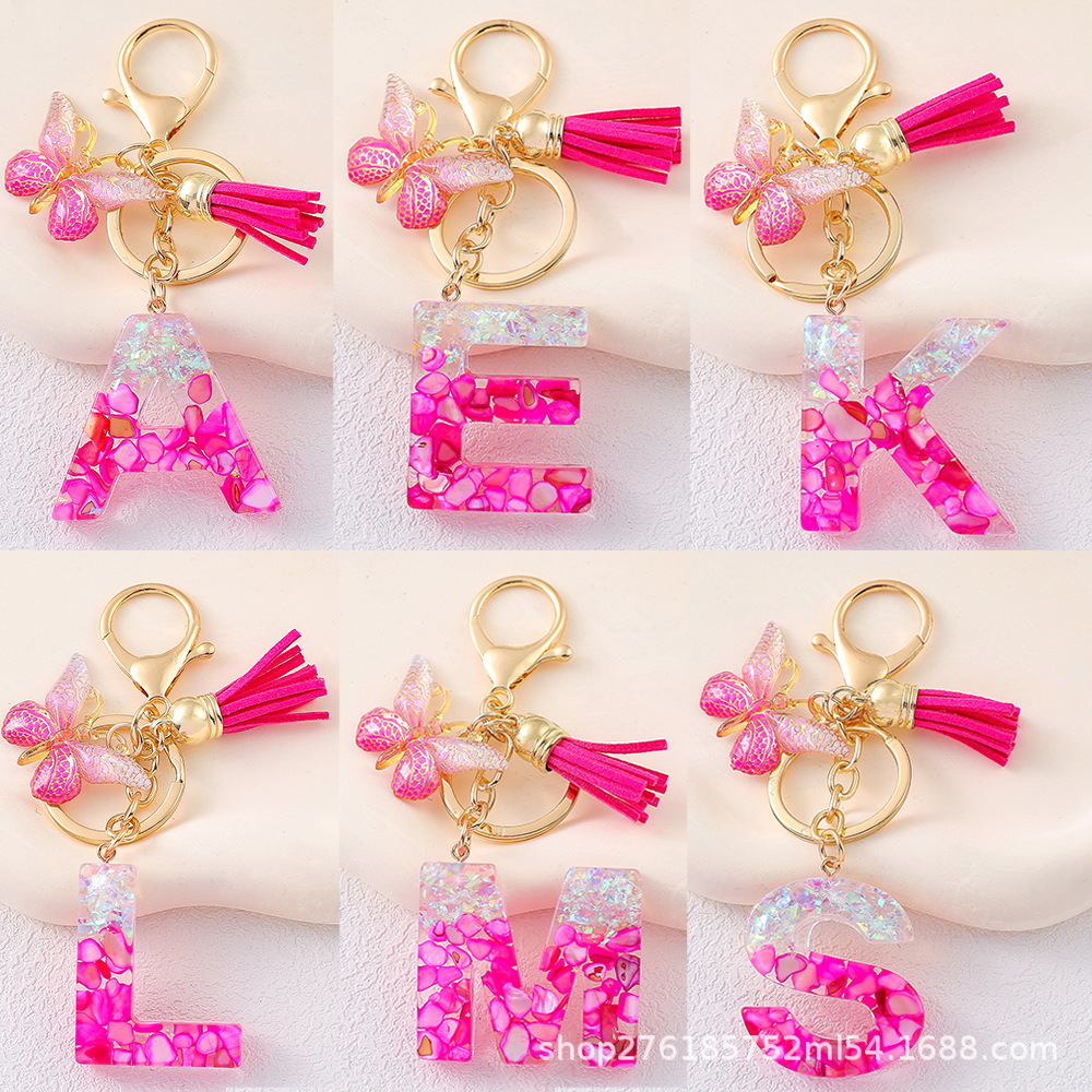 2024 explosión llavero joyería de resina letras bolsos colgantes de dama conchas rojas llavero colgantes de mariposa