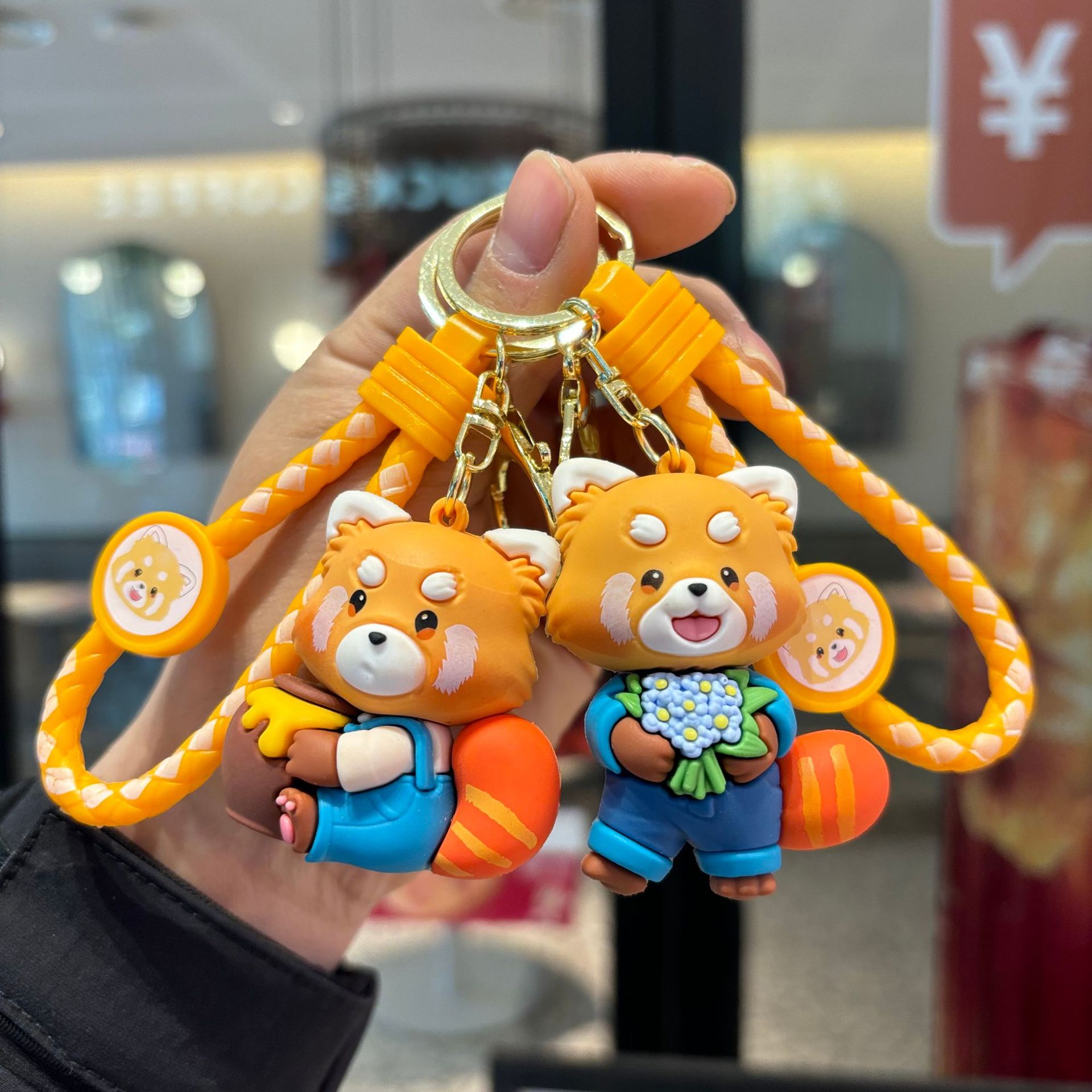 Transfronterizo juguetón panda llavero trenzado muñeca de goma suave muñeca de alto nivel agarrar el bebé pequeño regalo