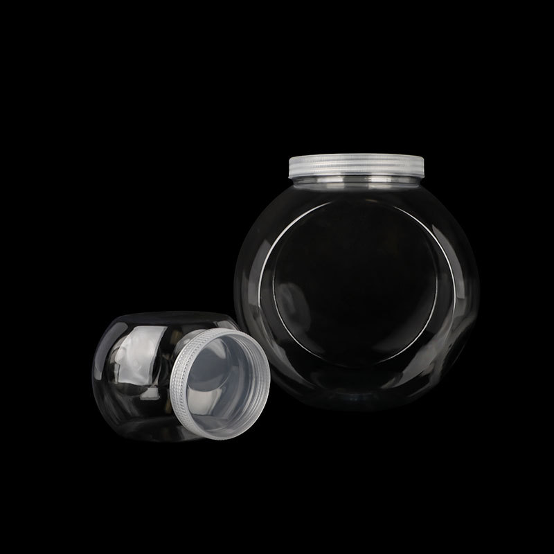 Botella de plástico transparente redonda al por mayor botella de plástico para mascotas alimentos tuerca caramelo plástico envasado de alimentos tarro con tapa
