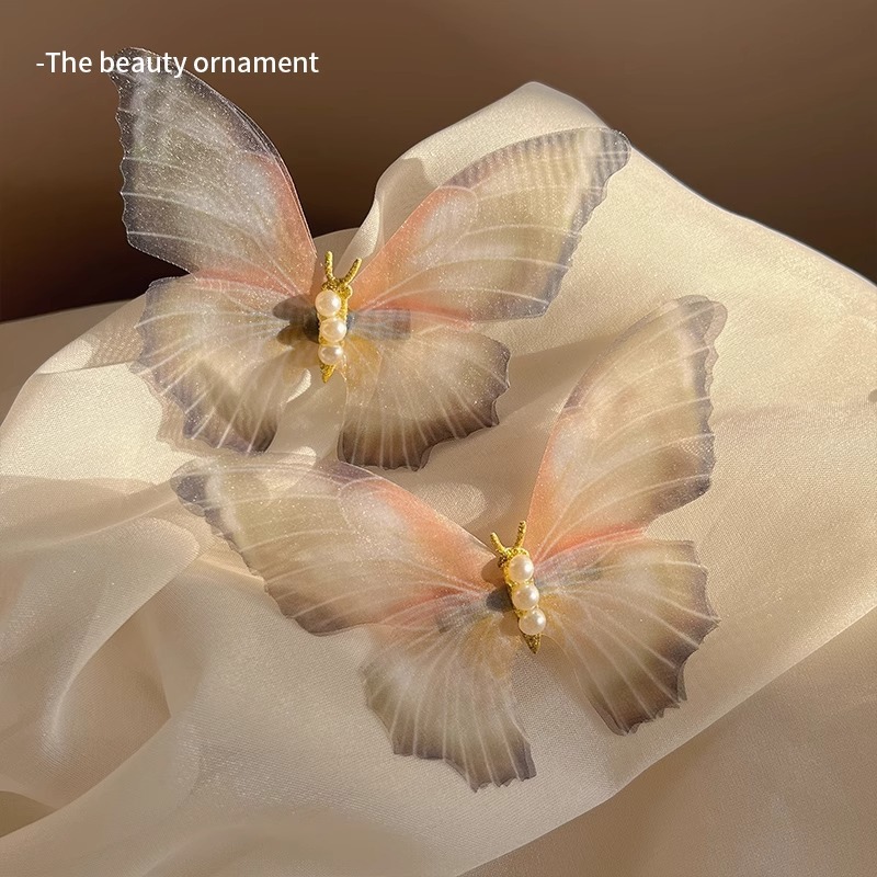 Clip de cabello de mariposa móvil ultra inmortal electrónica azul tulle perla clip de boca de pato decoración accesorios de playa clip tocado