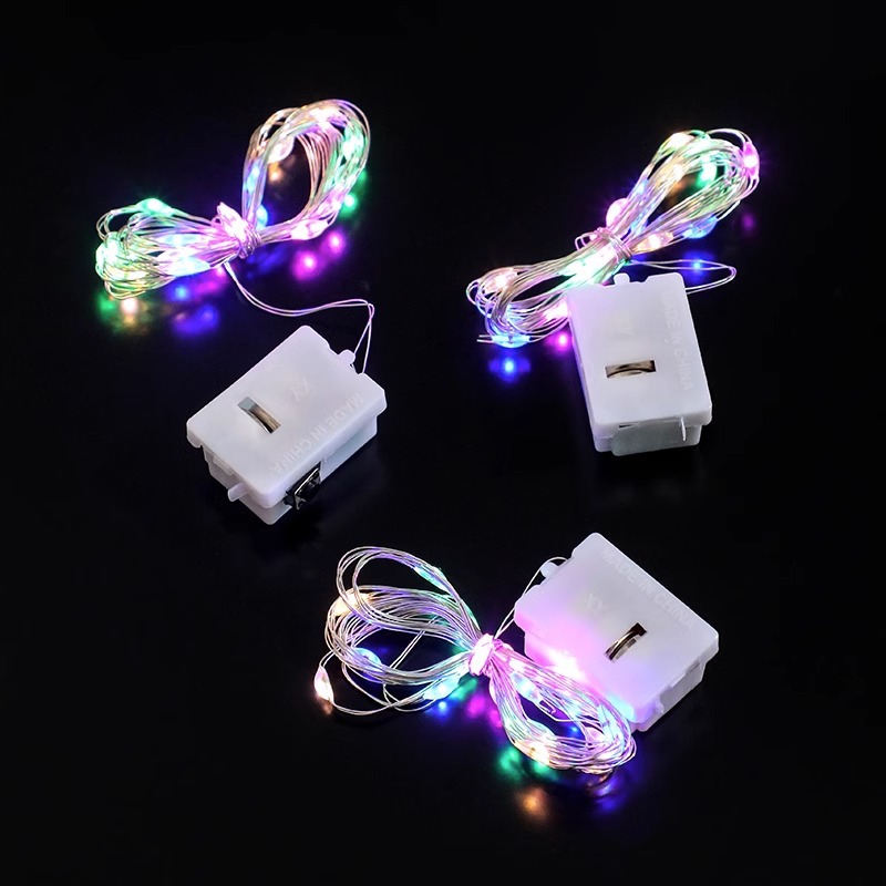 LED botón batería pequeña caja blanca flores de colores luces de cadena al por mayor árbol de Navidad decoración de alambre de cobre atmósfera luces de cadena