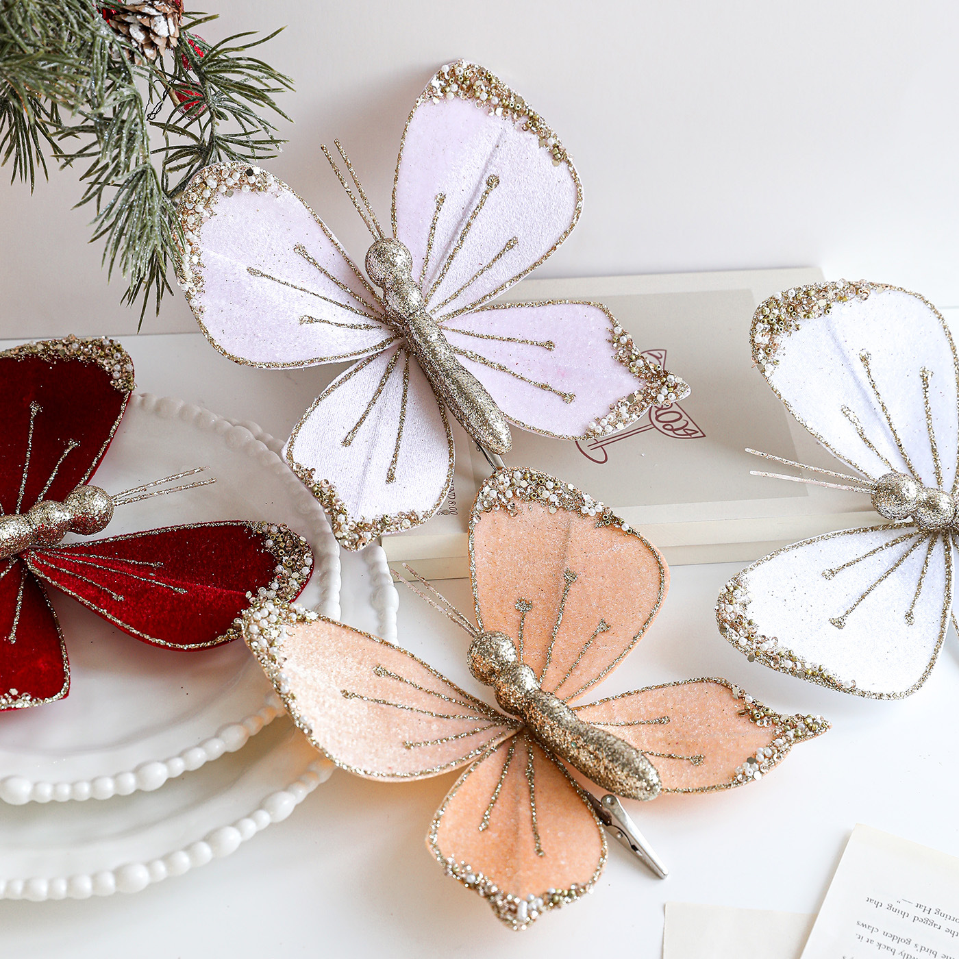 Nuevos productos de tela de alta calidad simulación de clip de arco de mariposa tela de vello polvo flocado árbol de Navidad decoración colgante diseño de escena