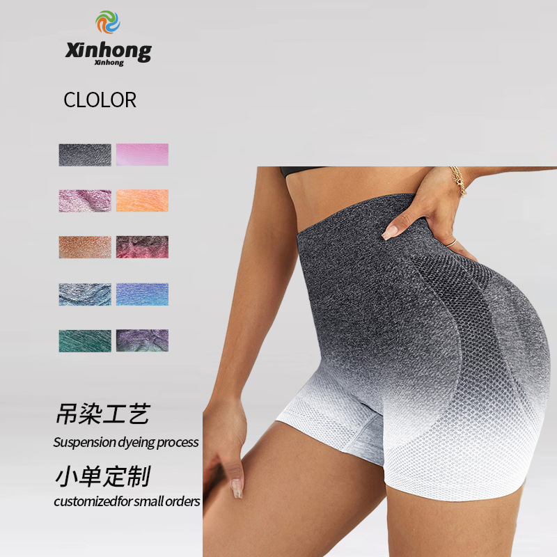 Pantalones cortos de yoga sin costuras teñidos con gradiente transfronterizo europeo y americano transpirables de las mujeres de secado rápido Melocotón Cadera apretada cintura alta estiramiento tres puntos