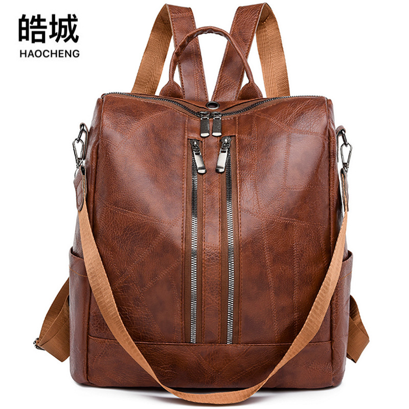 Comercio exterior al por mayor 2023 nueva mochila de cuero suave para mujer retro simple y versátil mochila de viaje multifuncional mochila escolar