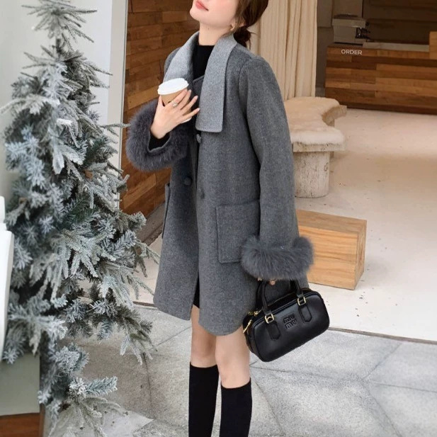 A stylish grey wool coat with a French bow collar, a new winter 2026 design, featuring a patchwork Chanel-inspired style.