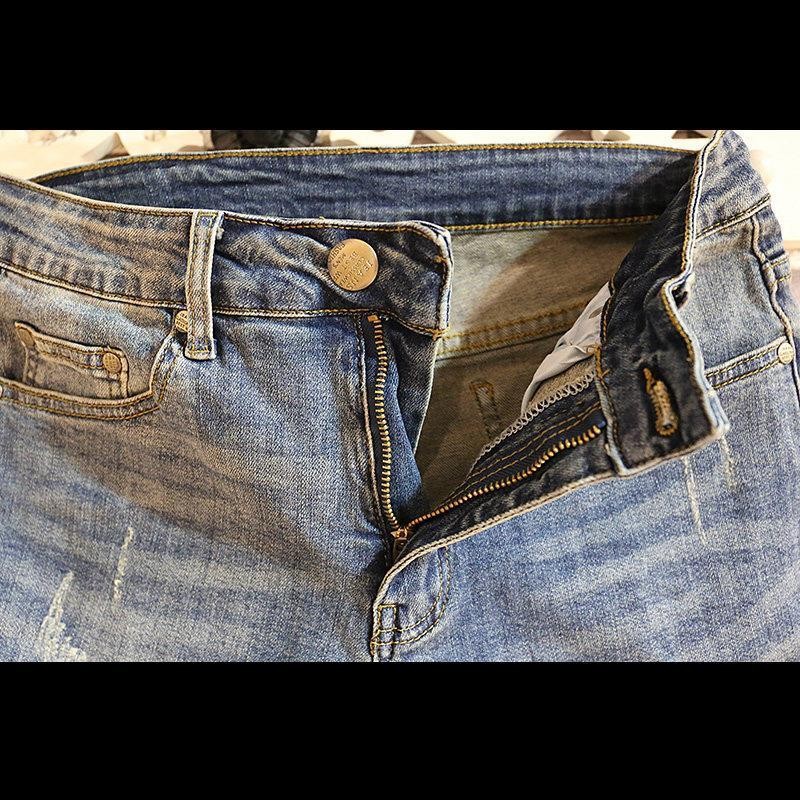 Verano marca de tendencia hombre jeans jeans de estilo coreano retro pantalones cortos rectos agujeros lavados con agua para hacer pantalones viejos