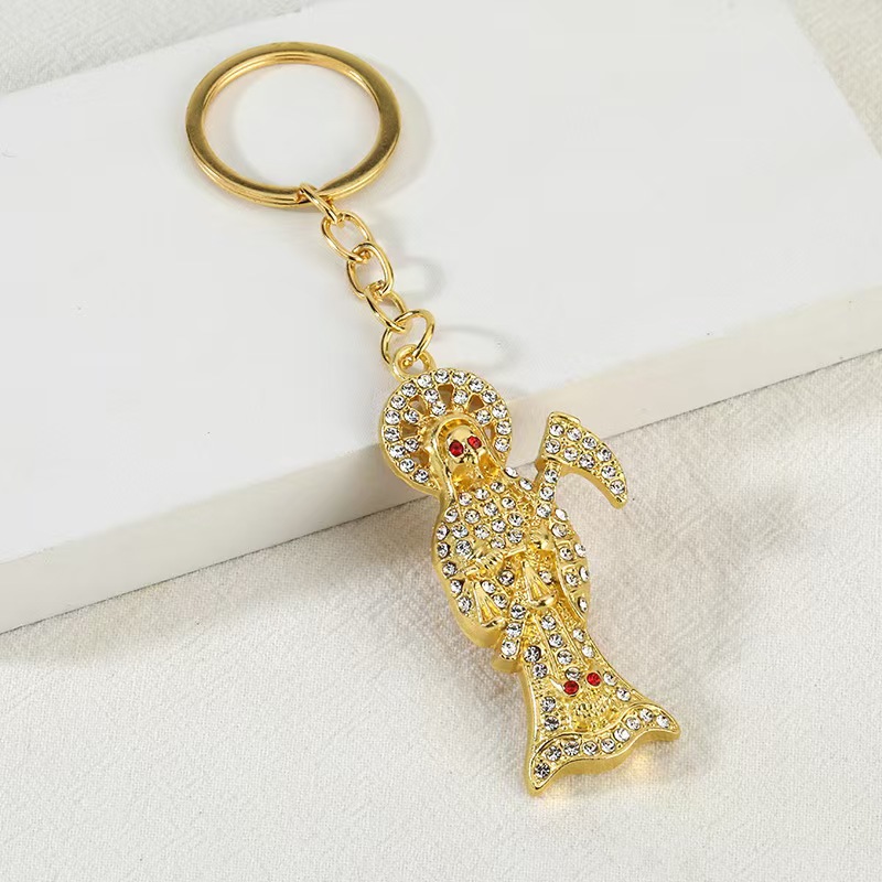 Fuentes transfronterizas de metal accesorios de joyería de diamantes completos llavero colgante collar colgante joyería de calavera de hoz creativa