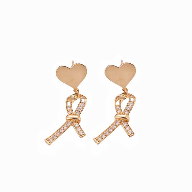 Estilo coreano nuevo melocotón corazón Stud pendientes de las mujeres de alta calidad de La pajarita Cruz diseño pendientes ins Internet Celebrity todo fósforo de la joyería de moda