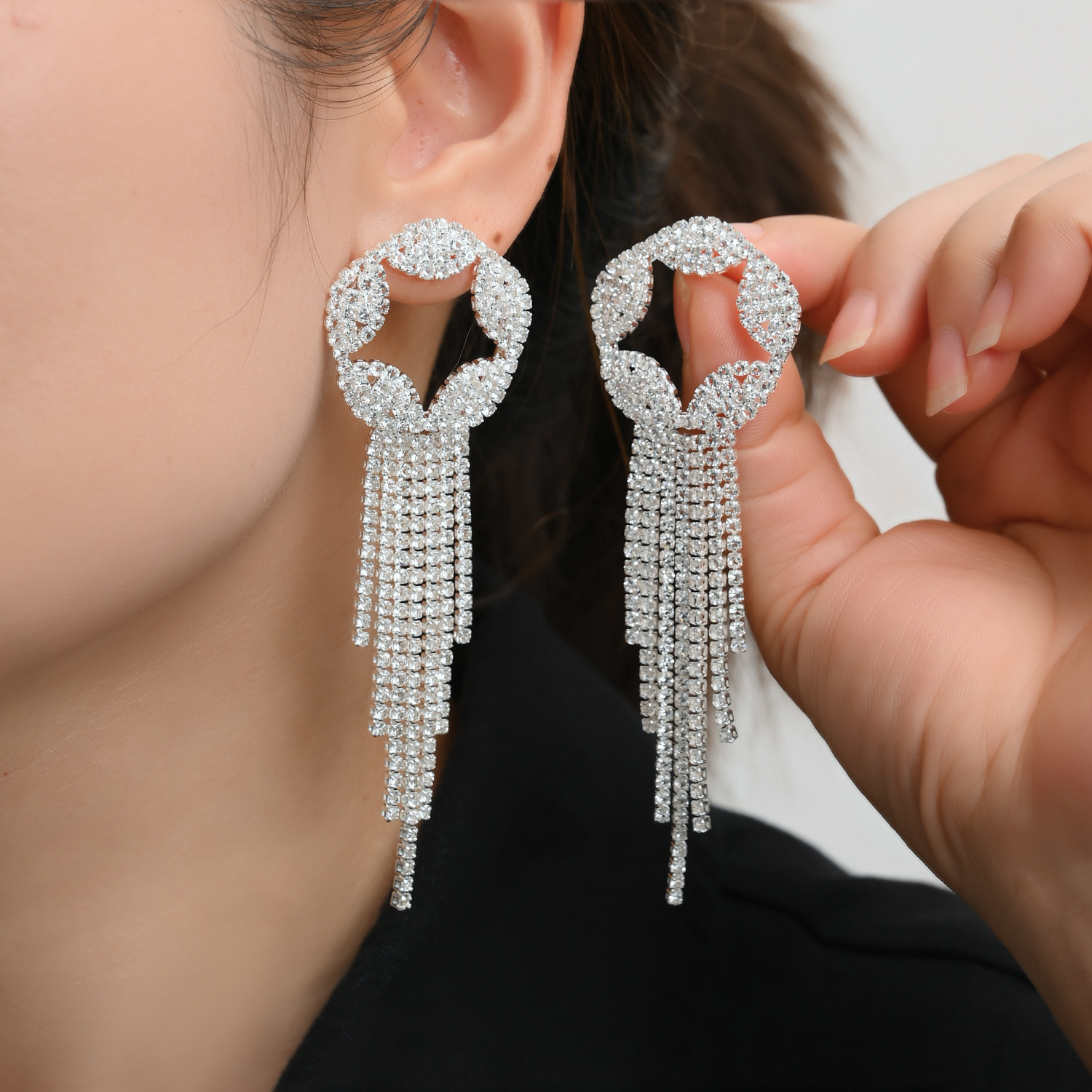 Fashionable shiny earrings with tassels with zircon