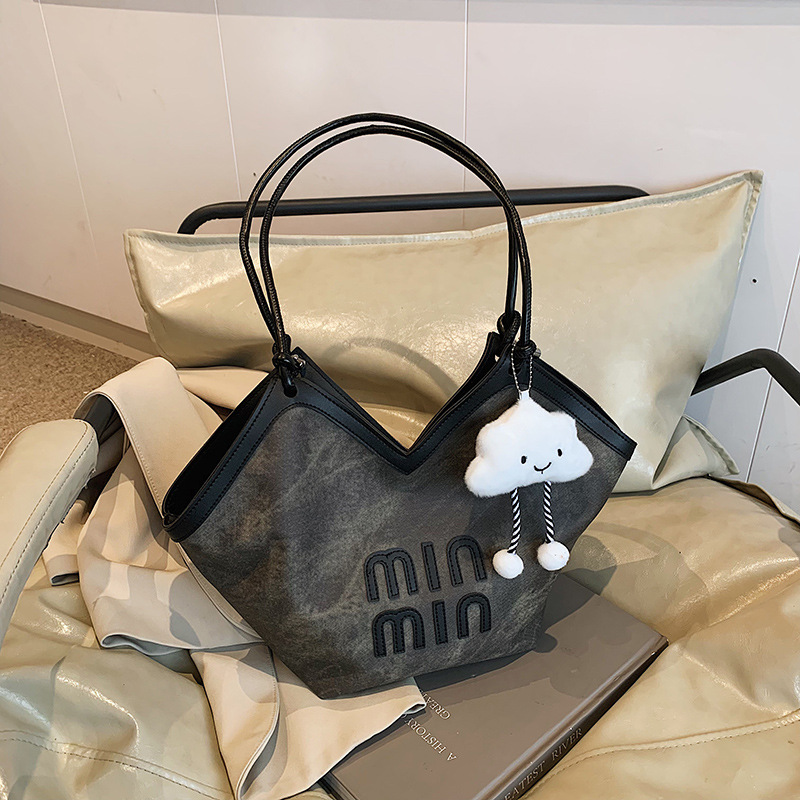 2024 nueva bolsa de gran capacidad para mujeres, bolso de hombro Sen Meng, bolso de diseño de nicho, bolso de viaje de alta calidad para mujeres
