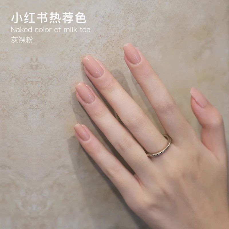 Demi-season fuchsia nail polish for manicure