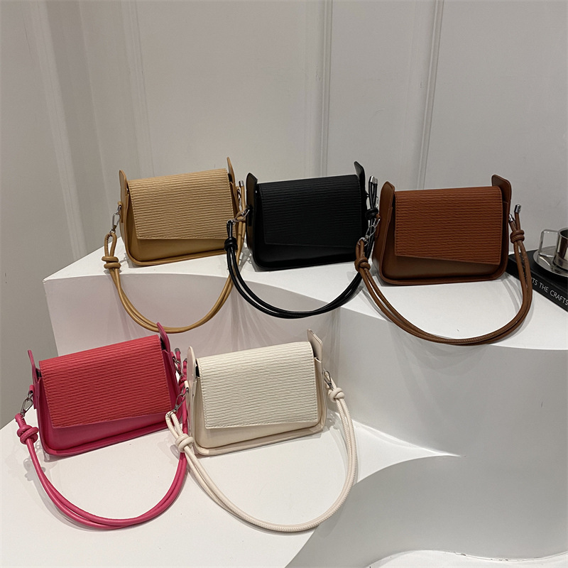 Bolsos de brazo de textura coreana retro mujeres 2025 primavera nueva moda de nicho de alta capacidad bolso de hombro