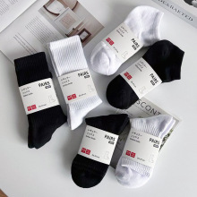 诸暨袜子男中高筒黑白纯色棉春秋款透气防臭吸汗运动袜潮流毛巾底